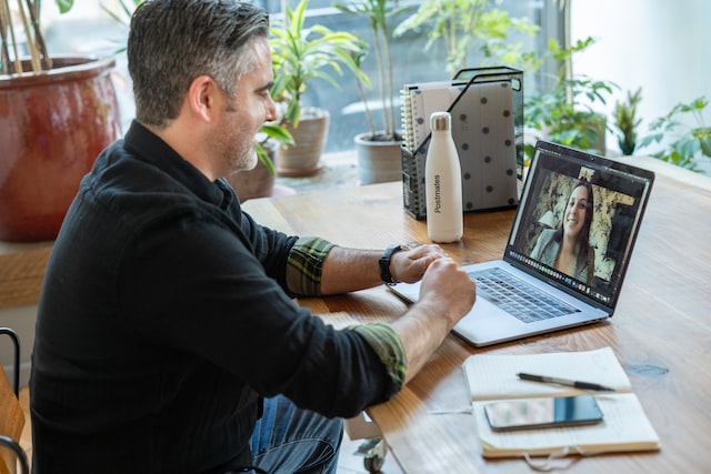 man on video call at desk