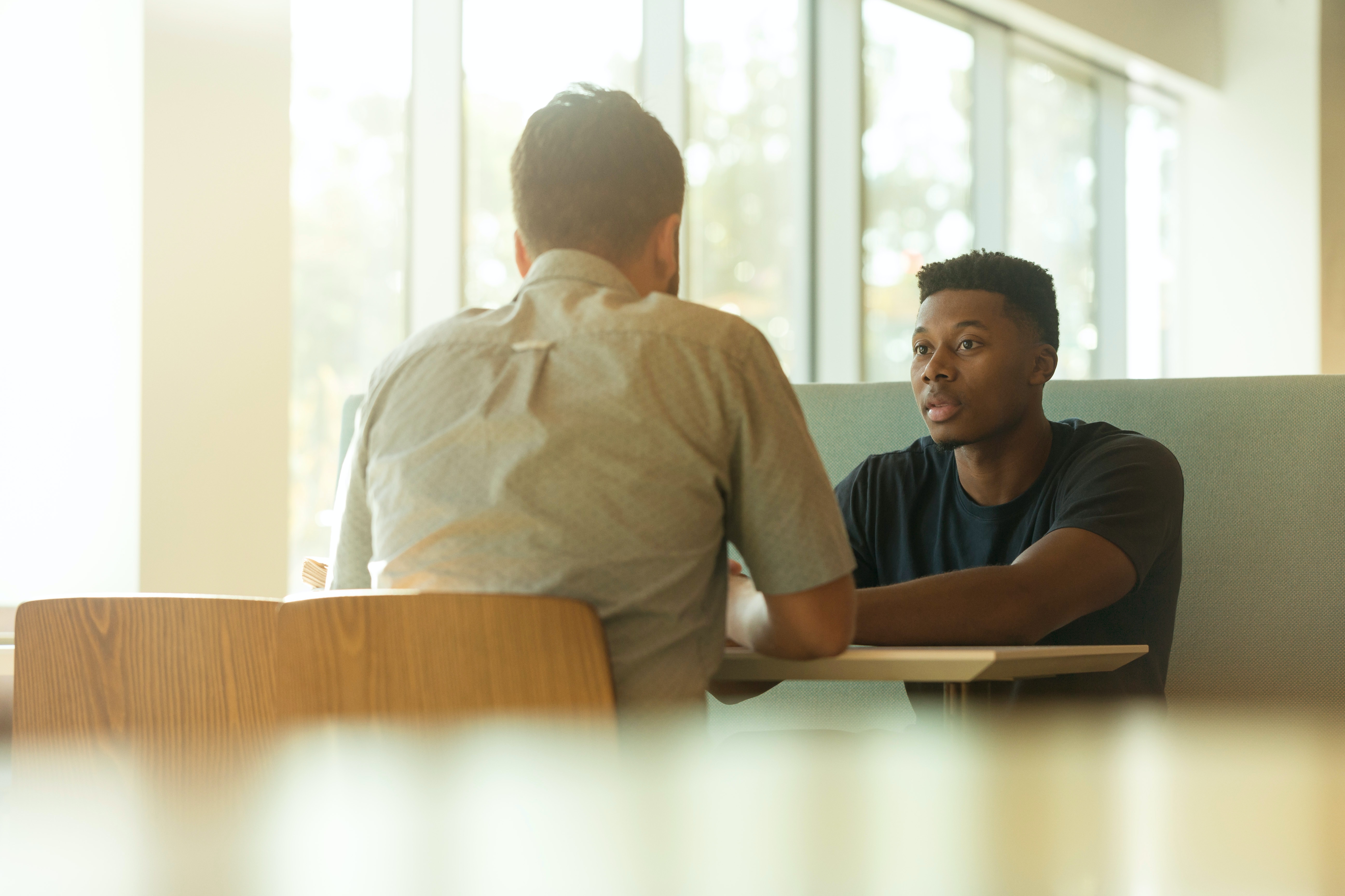 Two men conducting performance review