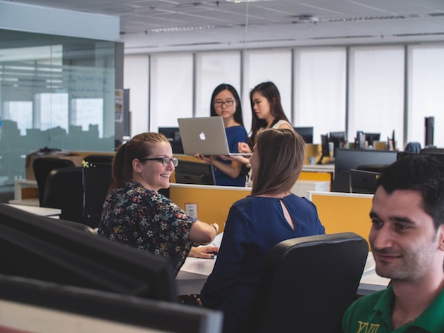 employees collaborating in office