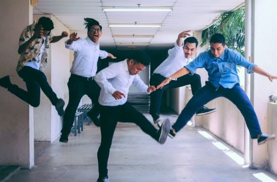 People jumping of joy outside