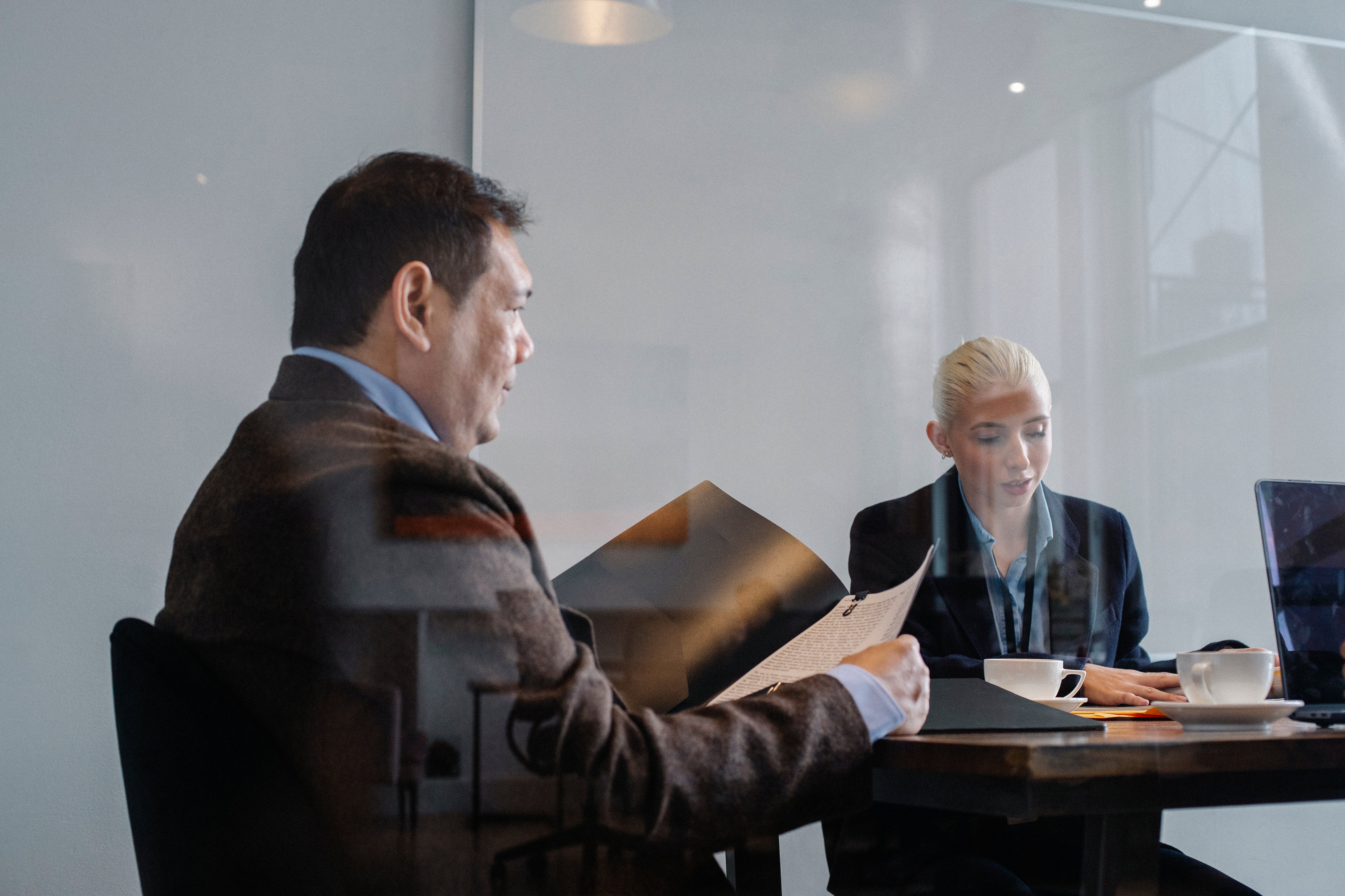 Conference room meeting with two people