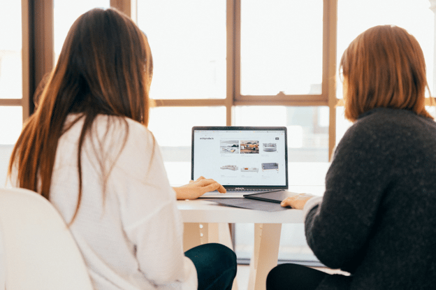women in front of computer screen