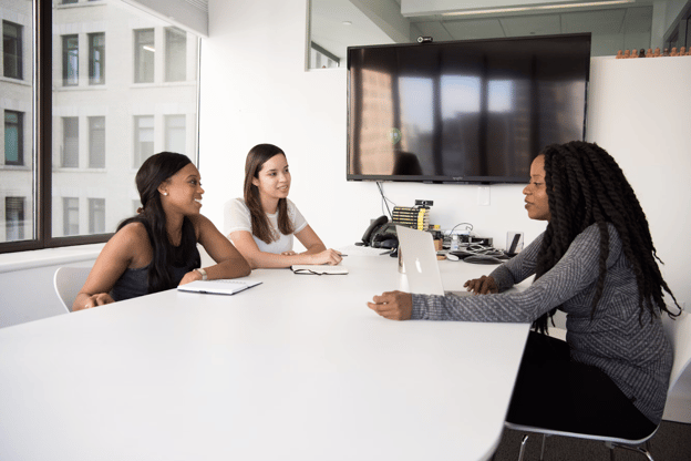 women employees collaborating in conference room