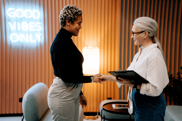 women shaking hands