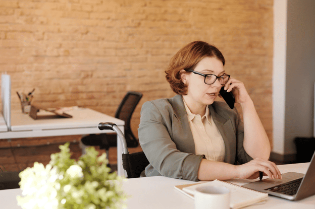 woman talking on phone in office